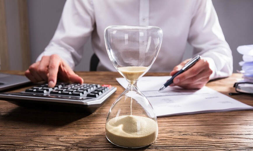businessperson-s-hand-calculat-235889965-squashed-1920w.jpg