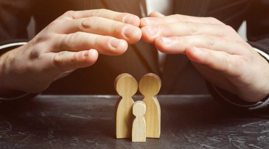 insurance-agent-holds-hands-ov-271364434-web_orig-1920w.jpg