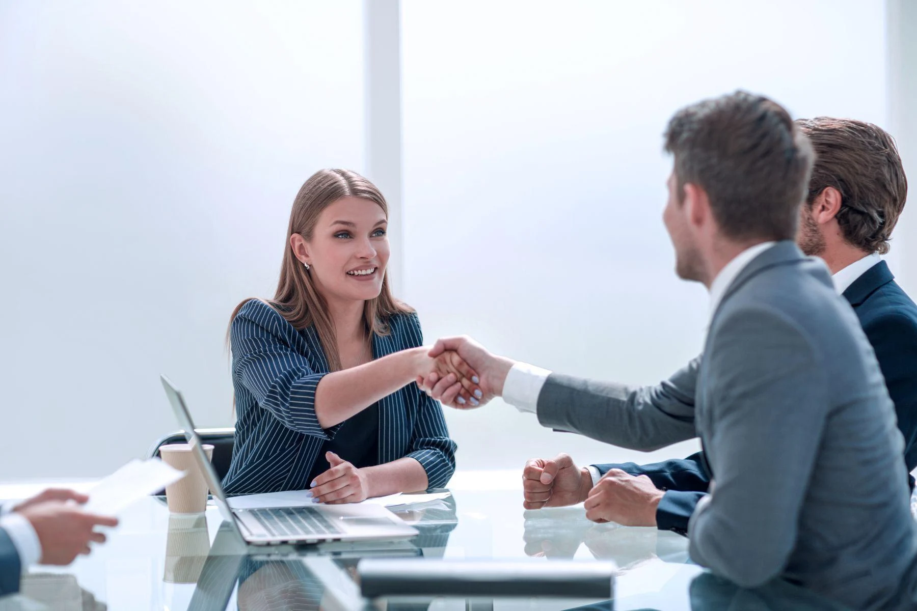 shaking-hands-after-a-successful-negotiation.webp