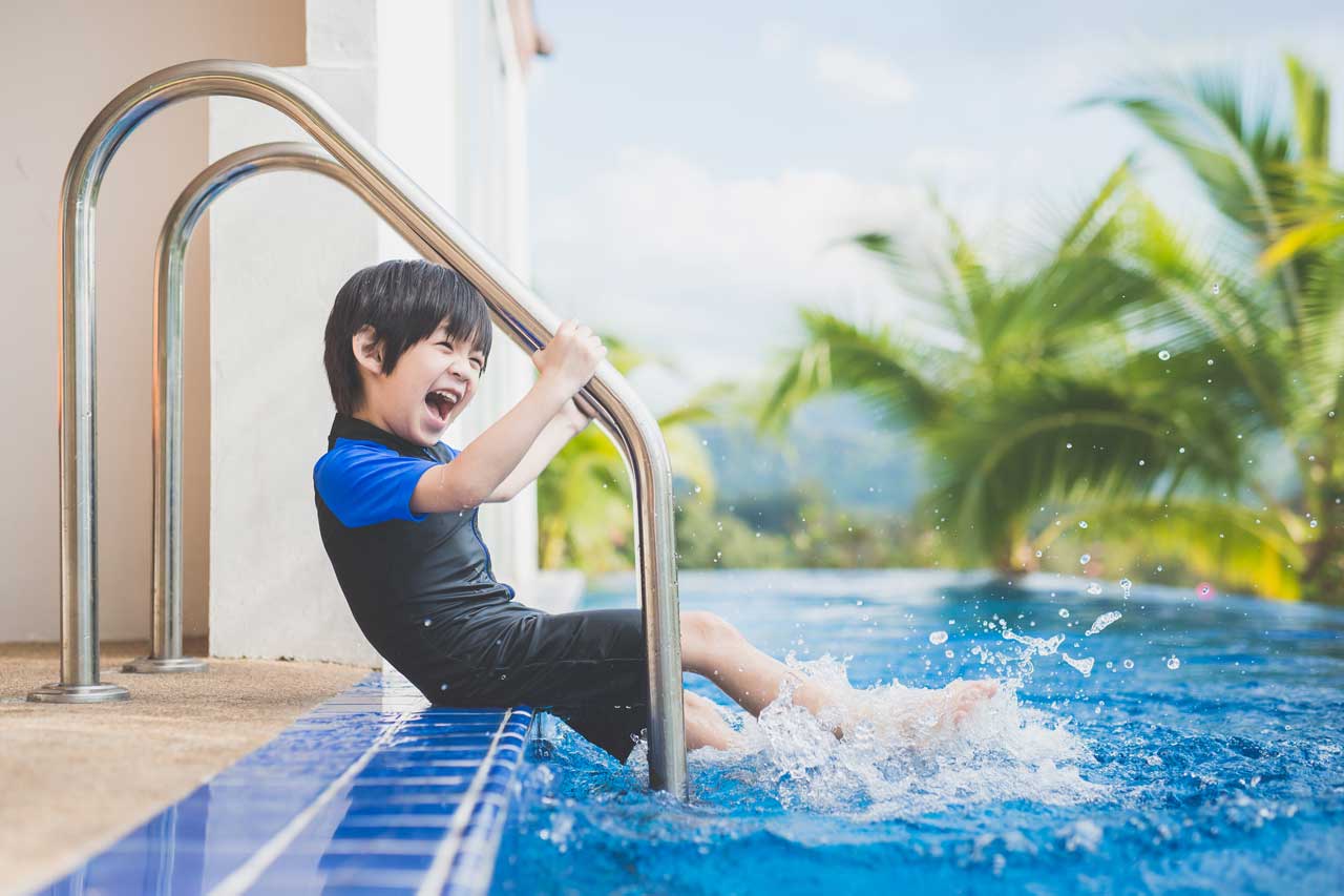 asian-child-splashing-in-pool-source-SS.jpg